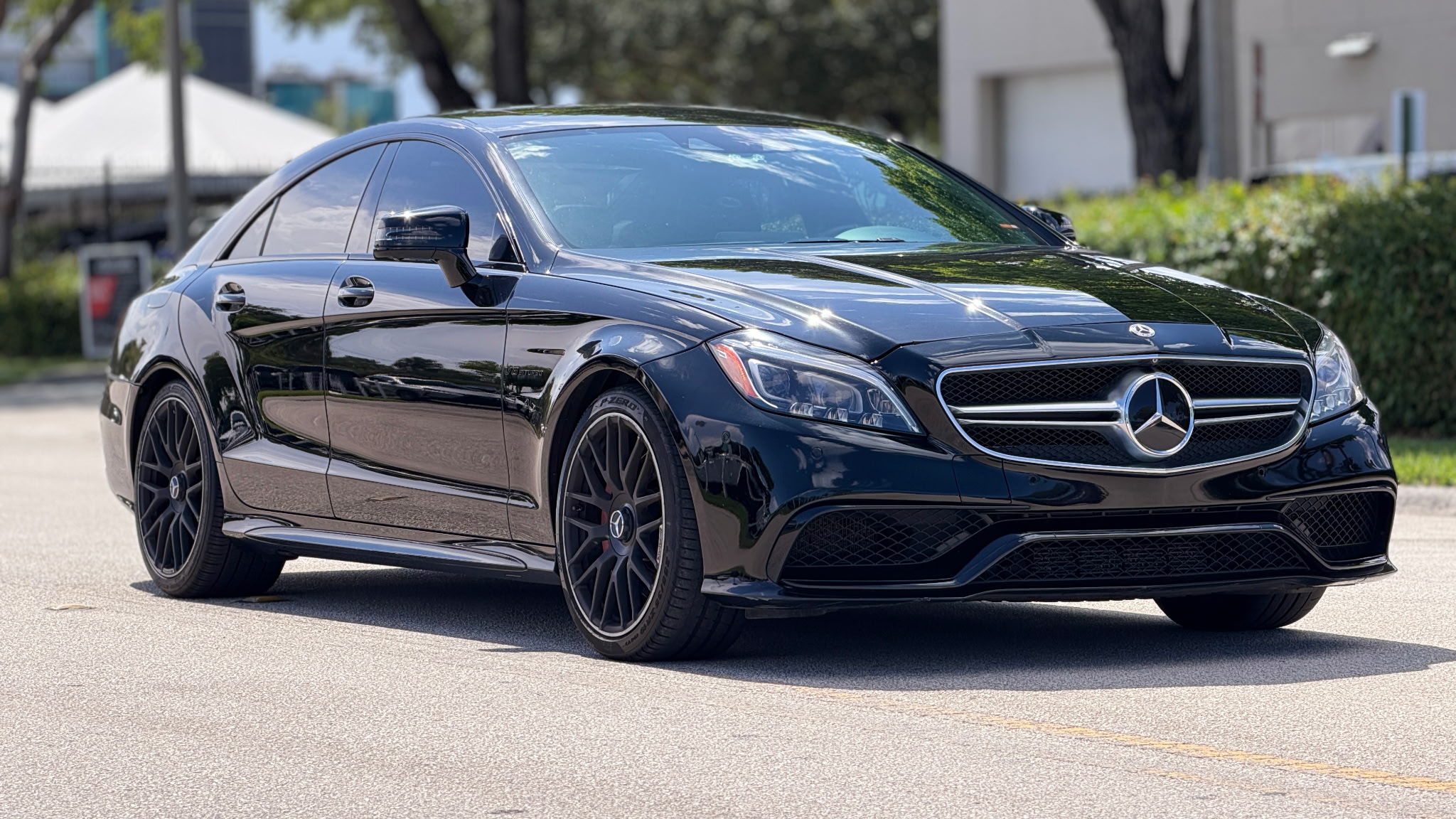 Federation Yard's black Mercedes-Benz CLS AMG parked outside the shop